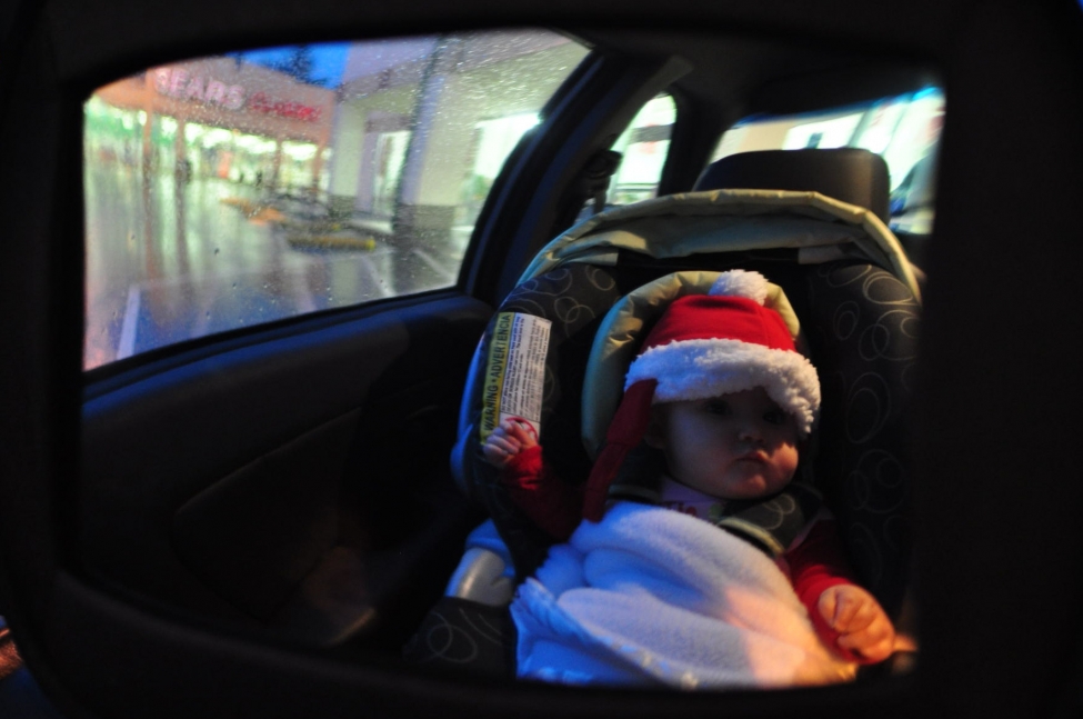 Waiting in the car while mommy finds a Christmas sweater. Ya, really.